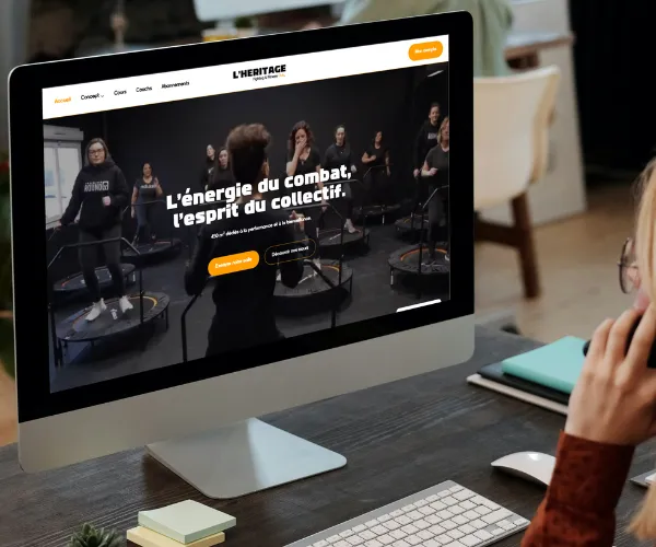 Mockup site L'Héritage Club sur écran